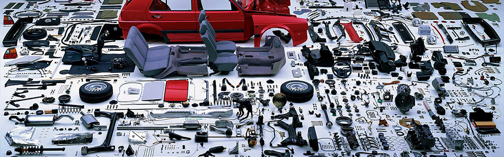 Automotive parts arranged on a workshop floor
