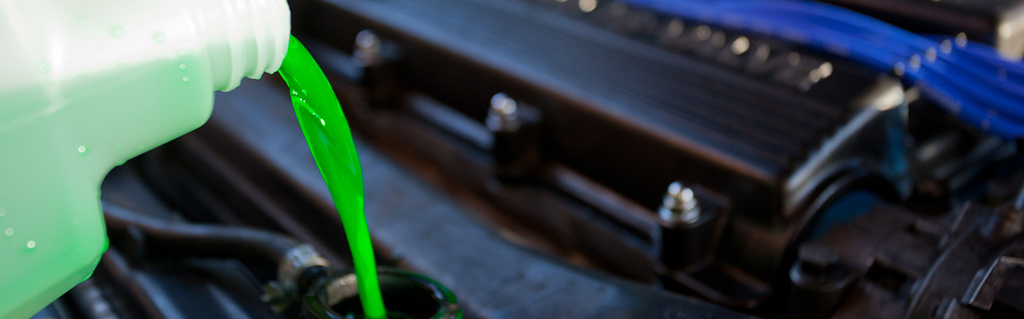 Coolant being poured into a vehicle
